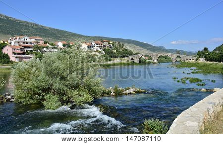 Arslanagica Most over Trebisnjica River in Trebinje Bosnia also known since 1993 as Perovica Bridge. Built by Ottomans in 1574 it was moved and physically rebuilt in 1970 a few kilometres from its orginal location.