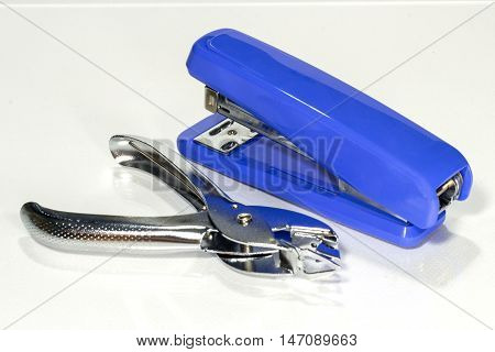 stapler and staple remover on white background
