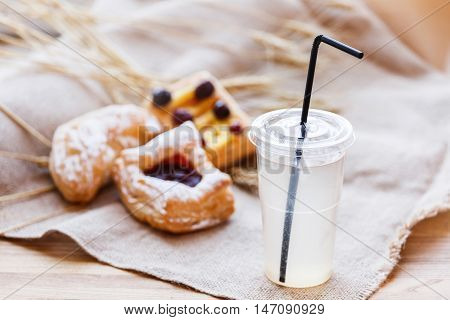 Fresh Compote Of Dried Fruits In Plastic Cups On Rustic Table Wi