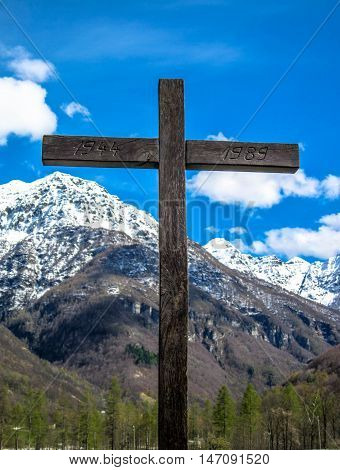 Wooden Cross in front of Mountain, Switzerland