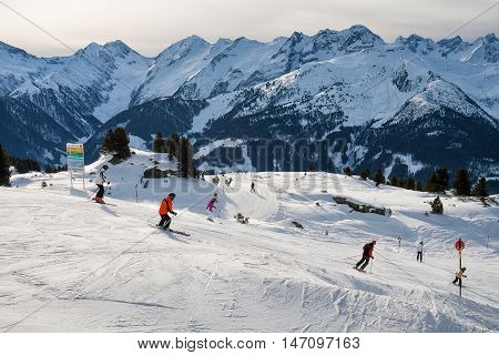 ZILLERTAL ARENA AUSTRIA - JANUARY 04 2011 - Group of skiers skiing down the mountain ski slopes