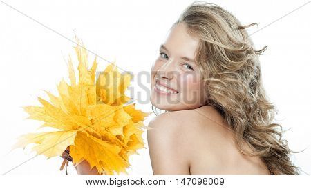 beauty closeup portrait of attractive  caucasian smiling woman  isolated on white studio shot lips toothy smile face hair looking at camera teeth hand holding yellow marple autumn leaves