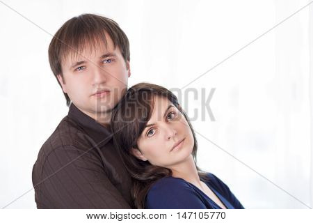 Portrait of Young Caucasian Family Standing Together Embrased.Horizontal Image