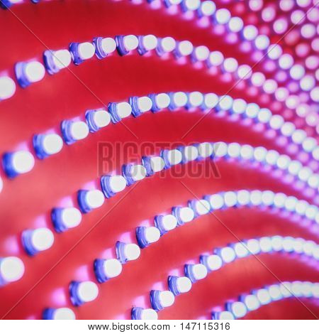 Picture of rows of theater marquee lights.