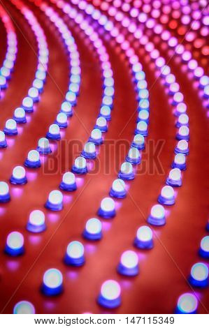 Picture of rows of theater marquee lights.