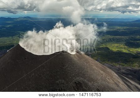Karymsky is an active stratovolcano. Kronotsky Nature Reserve on Kamchatka Peninsula. View from helicopter.