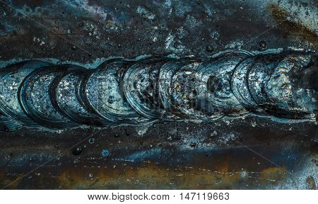 welding seam onto steel sheet metal Industrial steel welder in factory