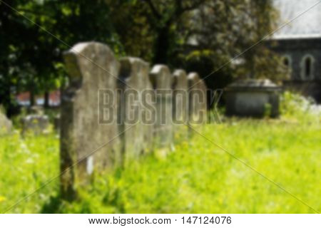 Grave Stones Outside A Church In Beaconsfield, Buckinghamshire, England Out Of Focus.