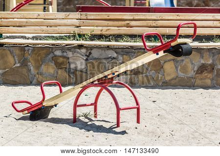 Children's playground, swing in the sand, summer