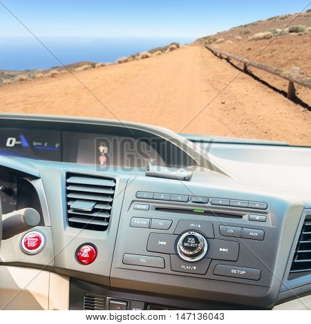 view of modern car dashboard with start power engine button and keys