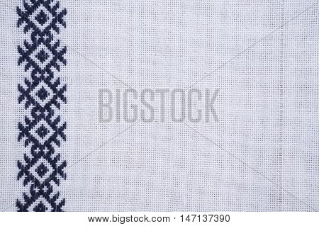 Fragment of hand embroidery on canvas. Background.