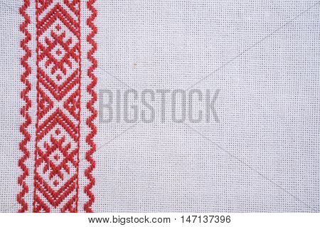 Fragment of hand embroidery on canvas. Background.
