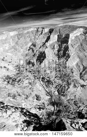 In Oman  The Old Mountain Gorge And Canyon The Deep Cloudy  Sky