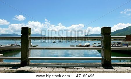 Boats, Pier, Lake And White Cloud In Sunny Day