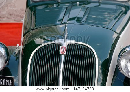 Kharkiv Ukraine - May 22 2016: Close up of retro car green Fiat Topolino manufactured between 1936 and 1955 is presented at the festival of vintage cars Kharkiv Retro Rally - 2016 in Kharkiv Ukraine on May 22 2016
