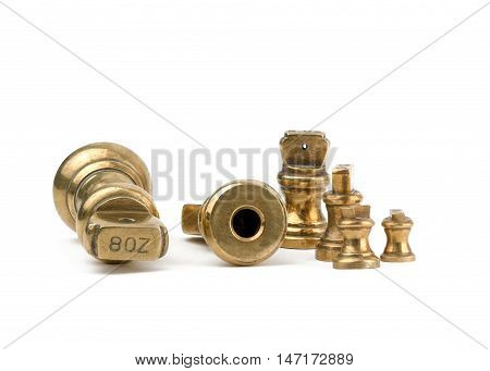 A set of antiques brass imperial weights isolated on a white background. with the 8oz showing