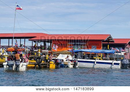 Semporna,Sabah-Sept 10,2016:Jetty of speedboats terminal in Semporna,Sabah,Borneo on 10th Sept 2016.Its a gateway for diving & snorkeling trips to the islands of Sipadan,Mabul,Mataking,Maiga & others