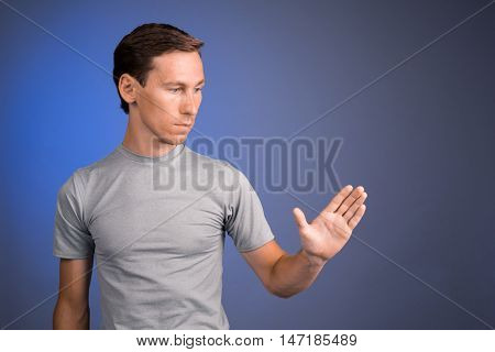 Man working with virtual touch screen.