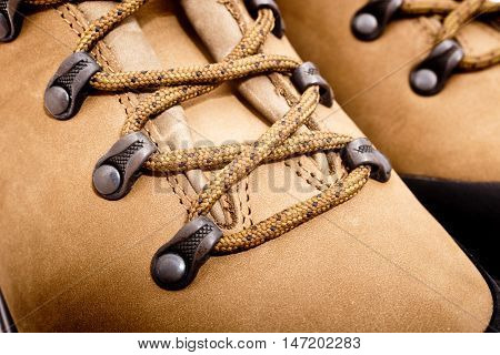 a detail of walking boots with bootlace