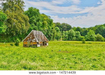 cailly France - june 23 2016 : an old barn in a meadow