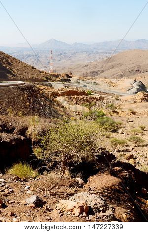 In Oman  The Old Mountain Gorge And Canyon The Deep Cloudy  Sky
