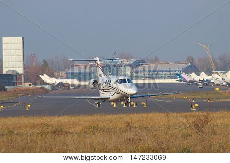 Kiev Ukraine - November 5 2011: Raytheon 390 Premier business jet is taxiing along the apron in the airport
