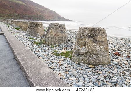 Anti-tank cubes from World War II to prevent invasion. Fairbourne beach North Wales United Kingdom Europe