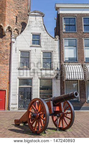 Historical cannon in front of a white house in Zwolle Holland