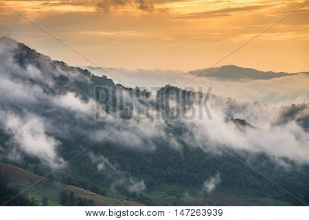 The mountains in the mist when the sunset.