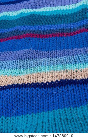 striped colorful wool texture handmade patten closeup macro blue red purple beige 
