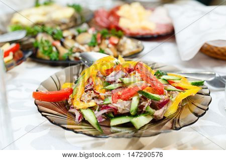 Fresh salads on a banquet table shallow depth of field