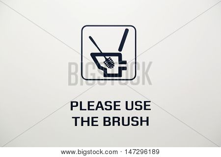 A toilet brush sign on white background