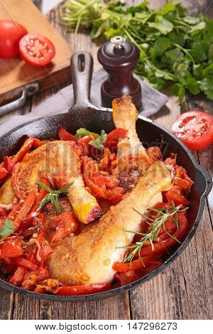 chicken leg cooked with tomato and herbs