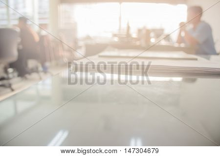 Businessmen blur in the workplace.Table Top And Blur Office of Background.abstract blur background table work in office with computer.Abstract background of office shallow depth of focus.