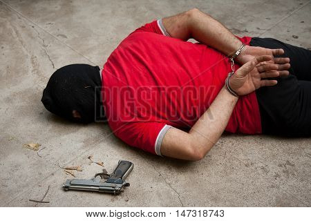 disgusting criminal with strong and thick dirty hands finally caught and handcuffed