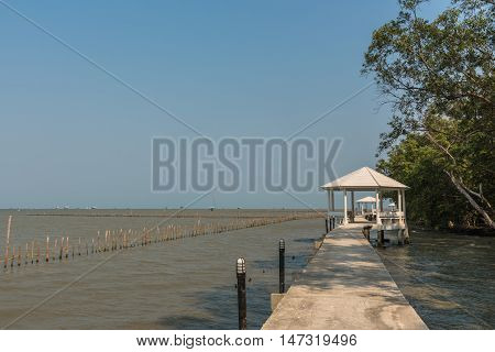 A footpath along by the sea with clear sky.