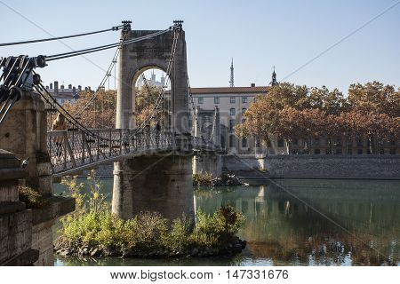 Old long grey pedestrian bridge in France