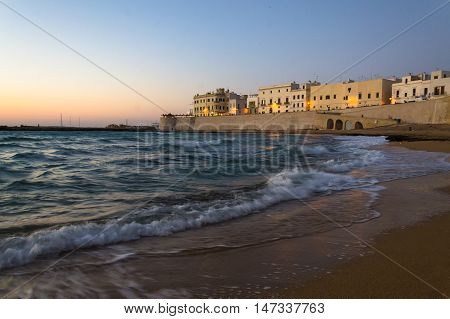 Beach city Gallipoli at sunset on a summer day