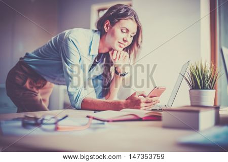 Young female businesswoman in the office