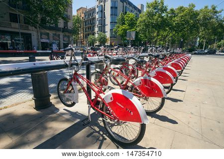 BARCELONA - MAY 21 2016: Row of rental bikes from Vodafone Bicing is a self-service bike-sharing scheme for short journeys.