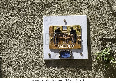 Street Sign For Via Amedeo, A Street In Old Amantea's, Terracotta With Men Who Clean The Fish.
