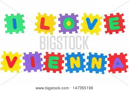 Message I Love Vienna from letters puzzle isolated on white background.
