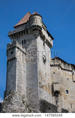 Ancient castle Liechtenstein donjon Vienna woods village Maria Enzersdorf Austria - against bright blue sky