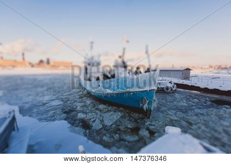 The Icebreaker Ship Trapped In Ice Tries To Break And Leave The Bay Between The Glaciers