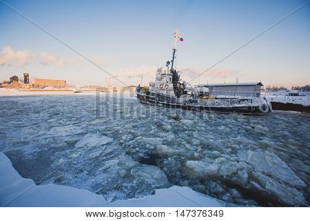 The Icebreaker Ship Trapped In Ice Tries To Break And Leave The Bay Between The Glaciers