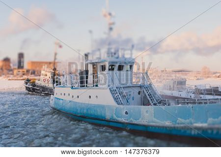 The Icebreaker Ship Trapped In Ice Tries To Break And Leave The Bay Between The Glaciers