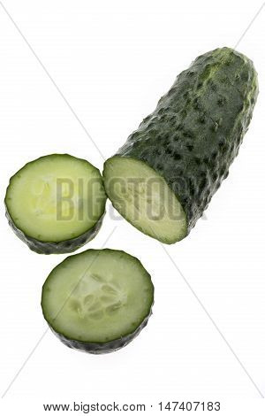 Cut cucumber on a white close-up batskground