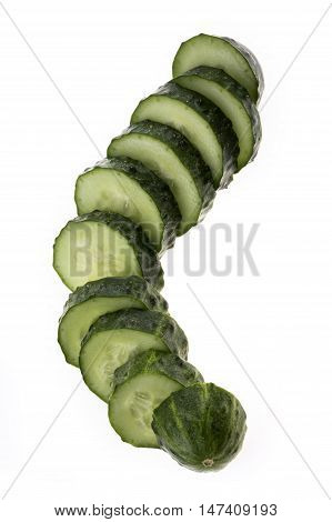 Cut cucumber on a white close-up batskground