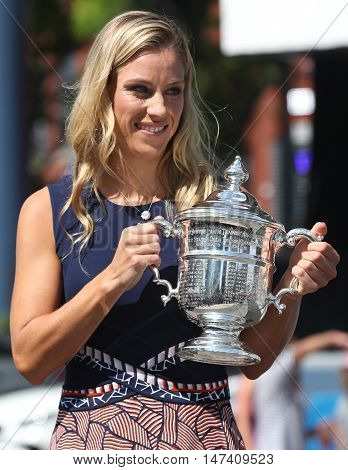 NEW YORK - SEPTEMBER 11, 2016:Two times Grand Slam champion Angelique Kerber of Germany posing with US Open trophy after her victory at US Open 2016 at Billie Jean King National Tennis Center