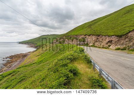 travel and countryside concept - asphalt road at wild atlantic way at connemara in ireland